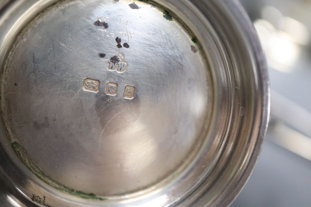 A modern cased silver three piece condiment set, with two later spoons, Wakely & Wheeler, London, 1957, 5oz.